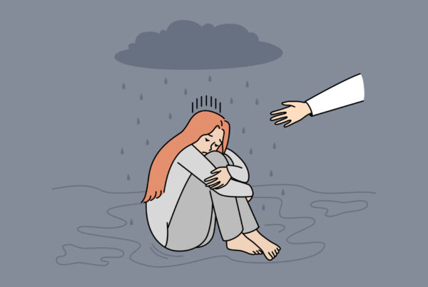 Smutna, odrzucona kobieta siedzi na podłodze, pojawia się wyciągnięta ręka, na którą nie reaguje