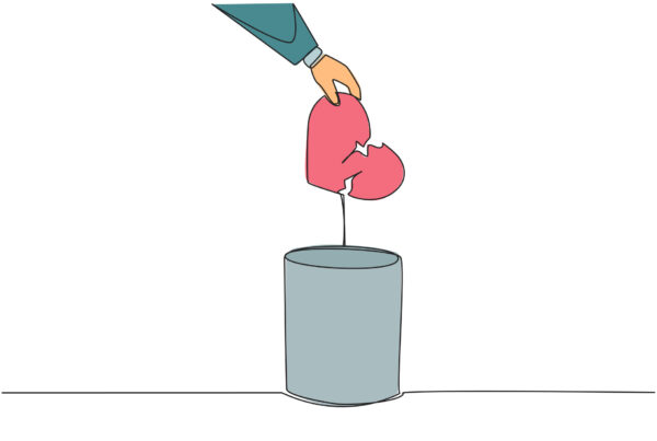 Ręka wyciąga złamane serce po rozstaniu z kosza jako metafora do psychoterapii.